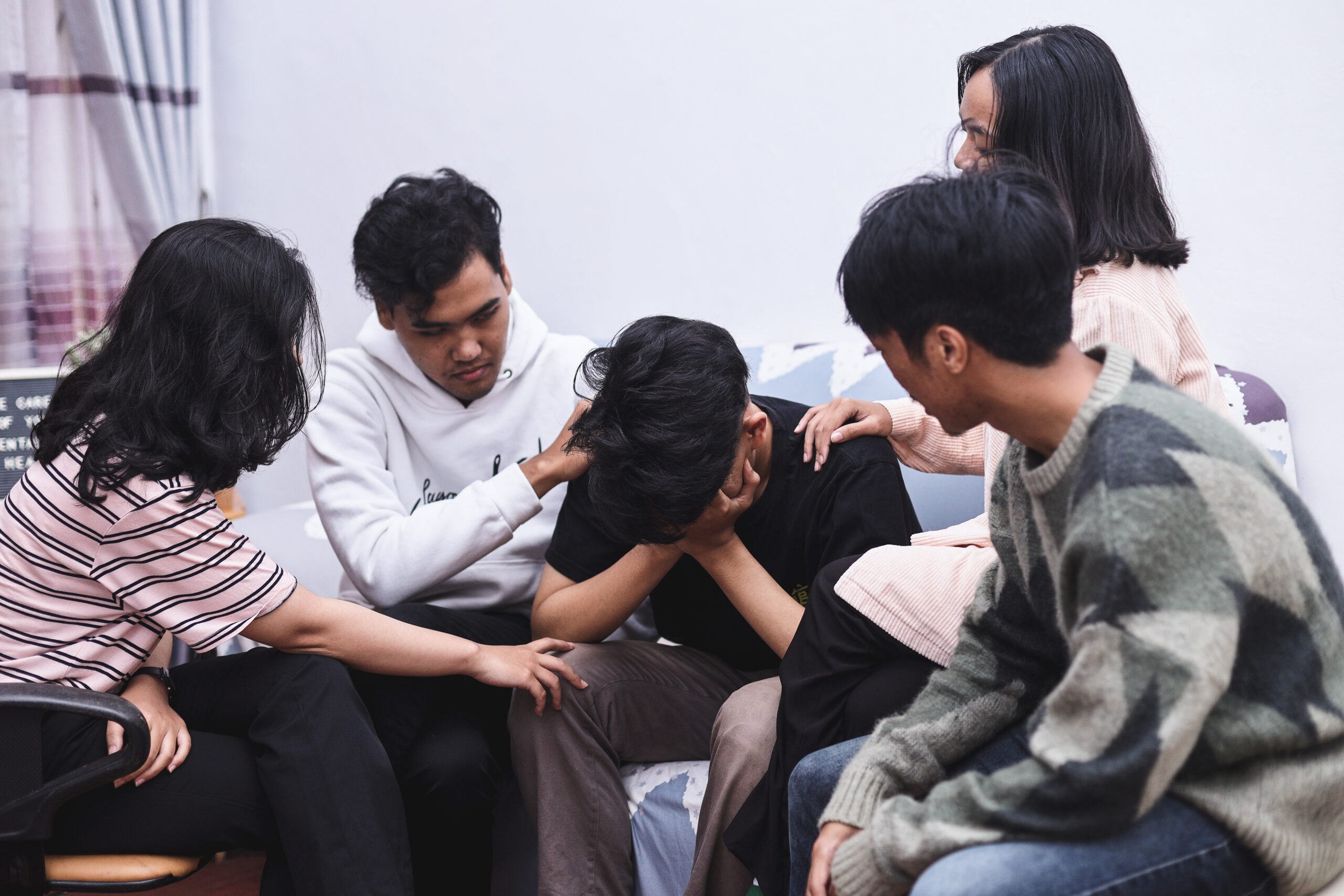 people helping a friend with mental health struggles